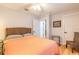 Cozy bedroom featuring hardwood floors and a ceiling fan at 2717 Needle Palm Dr, Edgewater, FL 32141