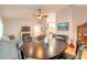 Bright dining room with an oval table and chairs near the kitchen at 2717 Needle Palm Dr, Edgewater, FL 32141