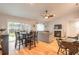 Dining area with a round table and chairs, open to the living room at 2717 Needle Palm Dr, Edgewater, FL 32141