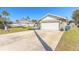 Long driveway leading to the house and garage at 2717 Needle Palm Dr, Edgewater, FL 32141