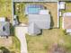 Aerial view showing house, pool, and driveway at 2720 Queen Palm Dr, Edgewater, FL 32141