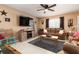 Living room with brown leather couches, a large TV, and a rustic feel at 2720 Queen Palm Dr, Edgewater, FL 32141