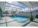 Enjoy this refreshing pool with a screened enclosure at 2720 Queen Palm Dr, Edgewater, FL 32141