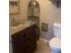 Bathroom with marble-top vanity and decorative mirror at 2723 Juniper Dr, Edgewater, FL 32141