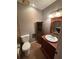 Clean bathroom with wood vanity, toilet and tiled floor at 2723 Juniper Dr, Edgewater, FL 32141