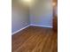 Bright bedroom featuring wood-look floors and a neutral color palette at 2723 Juniper Dr, Edgewater, FL 32141