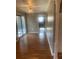 Bright dining room with wood-look floors and view of kitchen at 2723 Juniper Dr, Edgewater, FL 32141