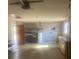 Attached garage with ample storage shelving and utility area at 2723 Juniper Dr, Edgewater, FL 32141