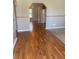 Hardwood floors and neutral-toned walls in the hallway at 2723 Juniper Dr, Edgewater, FL 32141