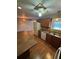 Galley kitchen with wood cabinets and laminate countertops at 2723 Juniper Dr, Edgewater, FL 32141