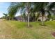 Landscaped backyard with screened pool and lush lawn at 2824 S Asciano Ct, New Smyrna Beach, FL 32168