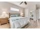 Serene bedroom featuring wood-look floors and ample closet space at 2824 S Asciano Ct, New Smyrna Beach, FL 32168