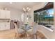 Breakfast nook with glass table and wicker chairs, overlooking the pool at 2824 S Asciano Ct, New Smyrna Beach, FL 32168