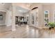 Home office with built-in shelving and a large desk, hardwood floors at 2824 S Asciano Ct, New Smyrna Beach, FL 32168