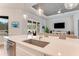 Open concept kitchen with stainless steel appliances, pendant lighting, and view of the living room at 2824 S Asciano Ct, New Smyrna Beach, FL 32168