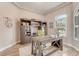 Spacious home office with built-in shelving and wood-look floors at 2824 S Asciano Ct, New Smyrna Beach, FL 32168