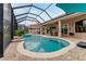 Inviting pool and spa with covered patio and outdoor dining area at 2824 S Asciano Ct, New Smyrna Beach, FL 32168