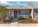 Brick and gray exterior of condo with landscaping and walkway at 2916 Duchess Oak Ct, St Cloud, FL 34769