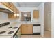 Full view of kitchen with wood cabinets and appliances at 2916 Duchess Oak Ct, St Cloud, FL 34769