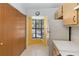 Kitchen corner with window, cabinets, and refrigerator at 2916 Duchess Oak Ct, St Cloud, FL 34769