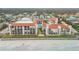 Aerial view of beachfront property showcasing building, pool, and oceanfront location at 3001 S Atlantic Ave # 501, New Smyrna Beach, FL 32169