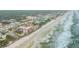 Aerial view of beachfront property and neighborhood at 3001 S Atlantic Ave # 501, New Smyrna Beach, FL 32169