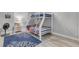 Bedroom with twin-over-full bunk bed and nautical theme at 3001 S Atlantic Ave # 501, New Smyrna Beach, FL 32169