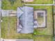 Overhead view of house and fenced-in pool in backyard at 3039 Tamarind Dr, Edgewater, FL 32141