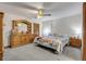 Main bedroom with wood furniture and ceiling fan at 3039 Tamarind Dr, Edgewater, FL 32141