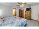 Main bedroom with wood furniture and ceiling fan at 3039 Tamarind Dr, Edgewater, FL 32141