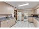 Bright kitchen with ample cabinetry and tile flooring at 3039 Tamarind Dr, Edgewater, FL 32141