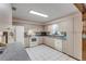 Galley style kitchen with white appliances and ample counter space at 3039 Tamarind Dr, Edgewater, FL 32141