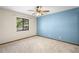 Cozy bedroom with light beige walls and carpet flooring at 3112 Needle Palm Dr, Edgewater, FL 32141