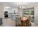 Cozy dining area adjacent to a modern kitchen at 3112 Needle Palm Dr, Edgewater, FL 32141