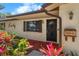 Front entrance with decorative accents and landscaping at 3112 Needle Palm Dr, Edgewater, FL 32141