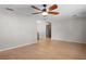 Bright living room with hardwood floors and ceiling fan at 3112 Needle Palm Dr, Edgewater, FL 32141