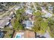 Home's aerial view, showing surrounding houses and trees at 3120 Pine Tree Dr, Edgewater, FL 32141