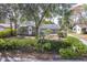 Brick house with mature landscaping, large yard, and driveway at 3120 Pine Tree Dr, Edgewater, FL 32141