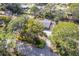 House nestled amongst lush greenery, viewed from above at 3120 Pine Tree Dr, Edgewater, FL 32141