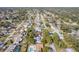 Aerial view of residential neighborhood showing homes with pools and lush landscaping at 3120 Pine Tree Dr, Edgewater, FL 32141