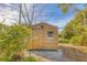 Wooden storage shed in the backyard at 3120 Pine Tree Dr, Edgewater, FL 32141