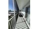 Spacious screened balcony with outdoor seating and water view at 315 N Causeway # 304, New Smyrna Beach, FL 32169