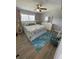 Bright bedroom featuring a king-size bed and coastal decor at 315 N Causeway # 304, New Smyrna Beach, FL 32169