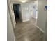 Hallway with light gray walls and wood-look flooring at 315 N Causeway # 304, New Smyrna Beach, FL 32169