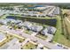 Aerial view of community with lake and homes at 3203 Monaco Blvd, New Smyrna Beach, FL 32168