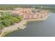 Aerial view of Venetian Bay buildings and lake at 3203 Monaco Blvd, New Smyrna Beach, FL 32168