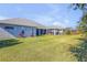 House with a large backyard and screened patio at 3203 Monaco Blvd, New Smyrna Beach, FL 32168