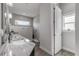 Double vanity bathroom with granite countertops and gray tile shower at 3203 Monaco Blvd, New Smyrna Beach, FL 32168