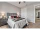 Comfortable bedroom with gray headboard and wood flooring at 3203 Monaco Blvd, New Smyrna Beach, FL 32168