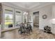 Charming breakfast nook with rustic table and four stools at 3203 Monaco Blvd, New Smyrna Beach, FL 32168